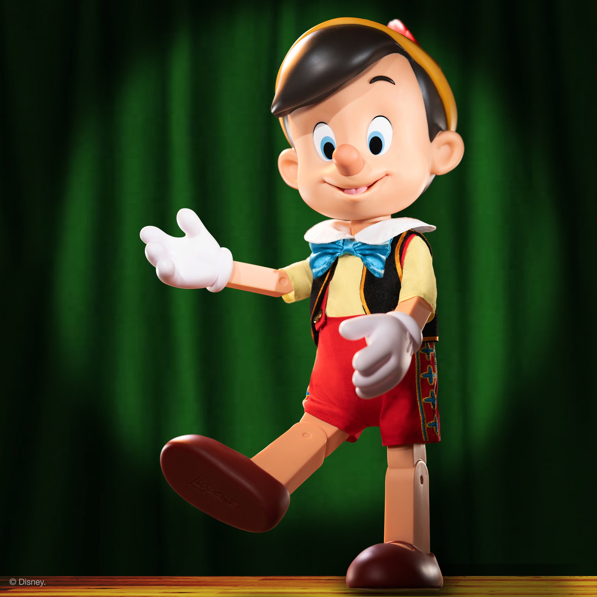 Pinocchio Supersize figure wearing cloth apparel, developed for Super7.