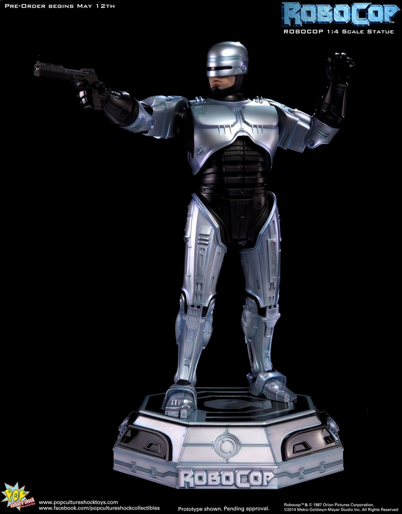 RoboCop collectible statue with raised pistol on a branded display base for Pop Culture Shock.
